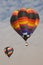 Multi color hot air balloons flying in blue sky