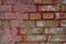 Multi-color old and grunge brick wall. Vintage background. Antique textures in small town.