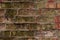 Multi-color old and grunge brick wall. Vintage background. Antique textures in small town.