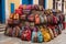 Multi-colored bags in a vendor\\\'s stall in the colonial streets of Cartagena\\\'s old city