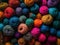 Multi-colored balls of yarn. View from above. Bright rainbow colors. Wool for knitting. Skeins of yarn for craft