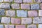 Multi-colored beautifully folded pavers. Old multi-colored stone blocks