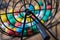 Multi-colored Bingo balls in a cage.