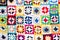 Multi colored blanket in wool, square geometric background, retro decorative pattern
