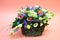 Multi-colored bouquet of flowers  in  basket