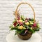 Multi-colored bouquet of flowers in basket