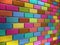 Multi colored bricks forming a wall. 3D illustration