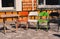 Multi-colored chairs and table in the street