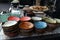 Multi-colored country-style faience plates for snacks, prepared for table setting