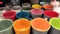 Multi-colored cups on the shelf in the market, tableware for sale