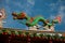 Multi-colored dragons against a blue sky. Chinese Temple Tua Pek Kong. Miri city, Borneo, Sarawak, Malaysia