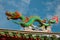 Multi-colored dragons against a blue sky. Chinese Temple Tua Pek Kong. Miri city, Borneo, Sarawak, Malaysia