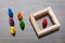 Multi Colored Figurine Pawn And Wooden Blocks On Desk