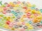 Multi-colored fruit rings in milk. Quick whole grain breakfast. Healthy nutrition - vitamins, minerals, fiber. Children food.