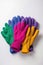 multi-colored gardening gloves lie on a white background, Generative AI