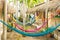 Multi-colored hammocks among palm trees at the hotel