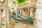 Multi-colored hammocks among palm trees at the hotel