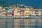 Multi-colored houses mirroring in the water