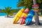 Multi-colored kayaks on a tropical sandy beach. Kayak rental. Tourist entertainment
