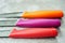 Multi-colored kitchen knives: red, burgundy, orange, yellow