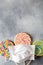 Multi colored lollipops covered medical mask top view flat lay copy space