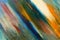 Multi-colored long diagonal watercolor strokes on canvas