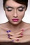 Multi colored manicure. Portrait of beautiful women holding her