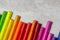 Multi-colored markers for drawing, tools for children's creativity top view on a gray background, copy space, close-up