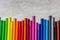 Multi-colored markers for drawing, tools for children's creativity top view on a gray background, copy space, close-up