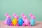 multi colored painted Easter eggs, pink Bunnies and flowers