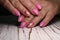 Multi-colored pastel manicure combined tone on tone with a striped background.Nail art