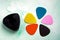 Multi-colored picks together with a pick holder