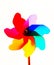 Multi colored pinwheel against white background.