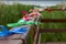 Multi-colored ribbons tied to the wooden railing of the bridge