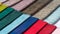 Multi colored set of upholstery fabric samples for selection, collection of textile swatches