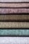 Multi colored set of upholstery fabric samples for selection, collection of textile swatches