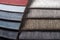 Multi colored set of upholstery fabric samples for selection, collection of textile swatches