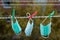 Multi-colored surgical masks hanging on a clothesline.Concept of reuse of medical masks or N95 masks