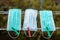 Multi-colored surgical masks hanging on a clothesline.Concept of reuse of medical masks or N95 masks