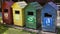 Multi-colored waste bins that