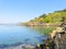 Multi coloured cliffs of slate line the shore of the River Dwyryd estuary