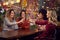 Multi-Cultural Group Of Female Friends Celebrating Making Toast Enjoying Party Night Out In Bar