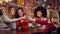 Multi-Cultural Group Of Female Friends Celebrating Making Toast Enjoying Party Night Out In Bar