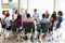 Multi-Cultural Office Staff Sitting Having Meeting Together