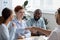 Multi-ethnic businesswoman shaking hands greeting company client