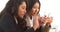 Multi-ethnic businesswomen working on smartphones