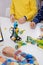 Multi ethnic children at technology lesson coding robot on tablet