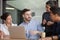 Multi-ethnic colleagues working together listening team leader