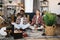 Multi ethnic couple meditation at room with boxes around