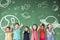 Multi-ethnic group of school children standing in classroom with space and star icon